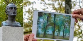 Munch-statue og ipad med kunsten hans på